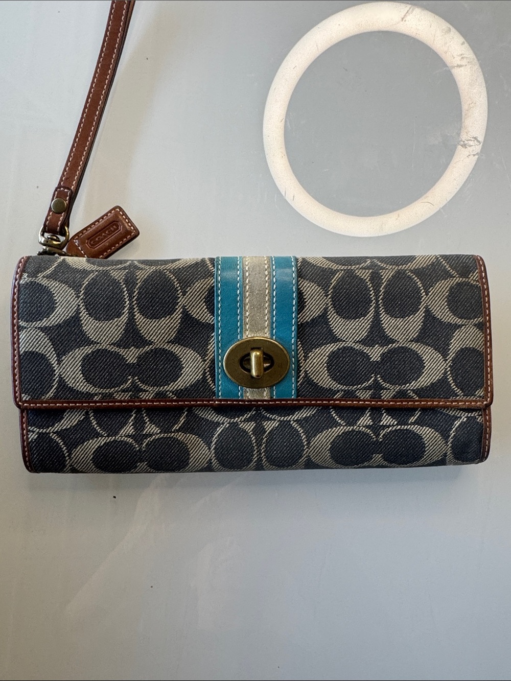 Coach Signature Denim Canvas turnlock with cognac leather wristlet and hangtag